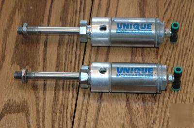 2 pneumatic cylinders, unique machine & tool co.
