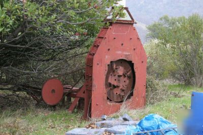 Hammer mill - huge flywheel with knives on it