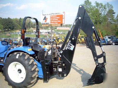 New bradco 511 tractor backhoe- holland, kubota, deere